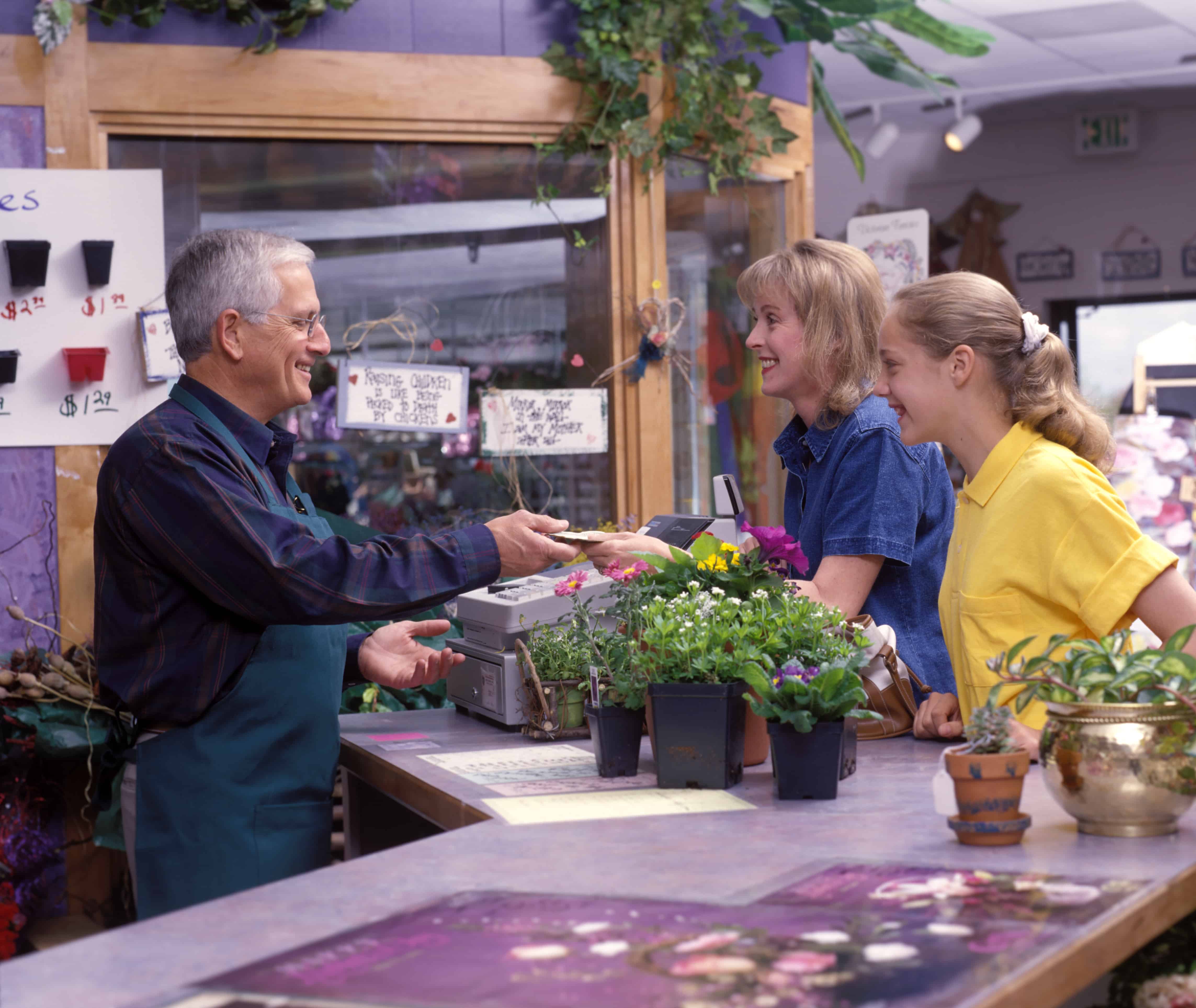 people in florist buying flowers